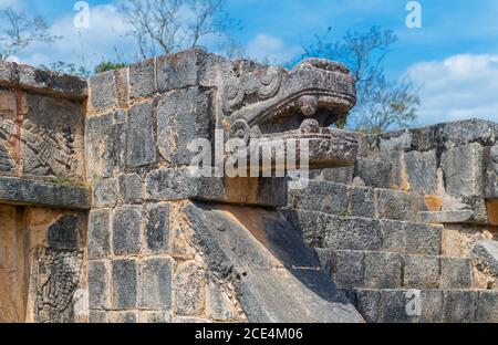 Stone sculpture of the feathered snake and god Quetzalcoatl, deity of creation and life for Aztec and Maya civilization, Chichen Itza, Mexico. Stock Photo