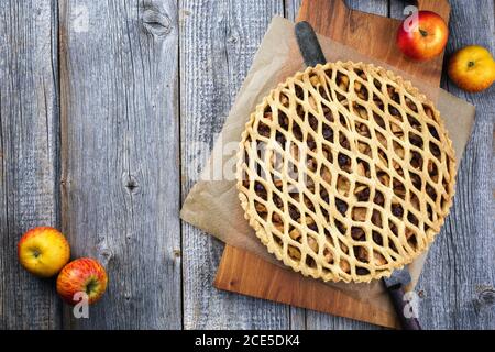 Traditional apple jalousie cake offered as top view on a modern design wooden board with copy space Stock Photo