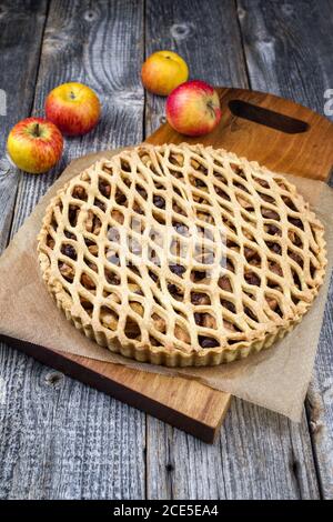 Traditional apple jalousie cake offered as closeup on a modern design wooden board Stock Photo