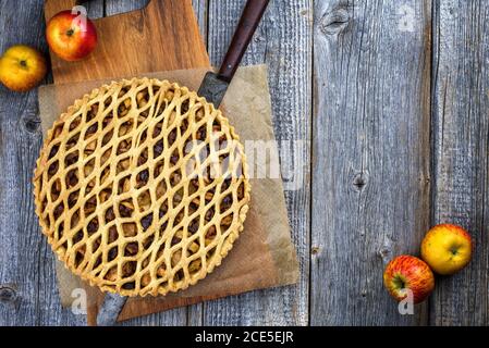 Traditional apple jalousie cake offered as top view on a modern design wooden board with copy space Stock Photo