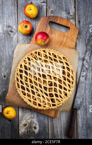 Traditional apple jalousie cake offered as top view on a modern design wooden board Stock Photo