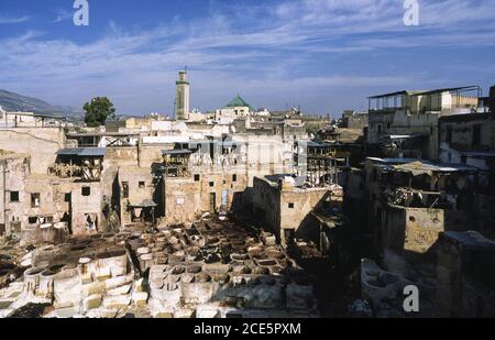 14.11.2010, Fes, Morocco, Africa - Elevated view over the roofs of a traditional tannery and dye factory in the walled medina with historic buildings. Stock Photo