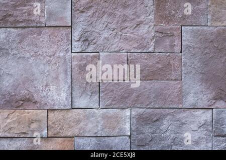 Squares abstract background, stone wall texture, brown tile floor, sidewalk. Granite brick surface. Architecture, masonry design. Grunge wallpaper. Ex Stock Photo