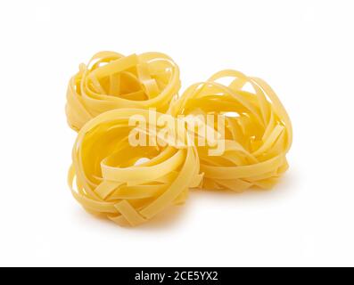 Shooting Tagliatelle placed on a white background from an angle Stock Photo