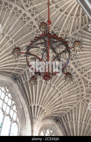 Finest fan vaulted ceiling in England, Bath Abbey Cathedral, UK. Sir Gilbert Scott, 19th century restoration architect. 150 year old red chandelier. Stock Photo