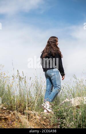 Teenage girl walking outdoors Stock Photo