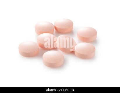 Pink pills placed on a white background.Medical image Stock Photo
