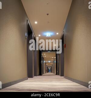 empty corridor with room doors in a hotel Stock Photo