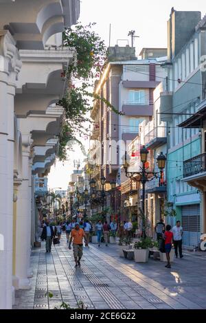 Santo Domingo, Santo Domingo Province, Dominican Republic - November 25, 2019: People walking down the street in the Colonial Zone in Santo Domingo. Stock Photo