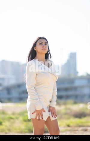 Beautiful pensive woman looking away outdoors Stock Photo