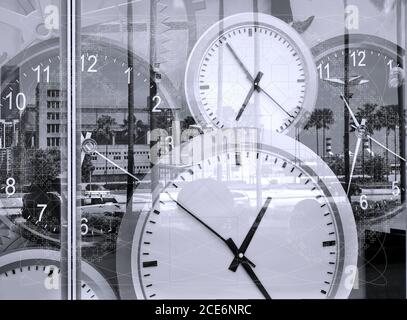 Large clocks reflecting in shop window illustrate the concept of time Stock Photo