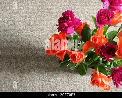 bouquet of decorative magenta & orange roses from above Stock Photo