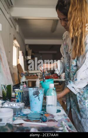 Young Female Artist Working in Studio Stock Photo - Alamy