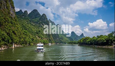 Tourist boat sailing on a Li River in China Stock Photo