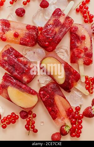 Homemade frozen various red berries natural juice popsicles - paletas - ice pops Stock Photo