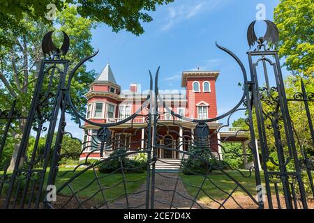 Caption Bangor, USA - 27th August 2014: Detail of the gate and house of Stephen King, in Bangor, Maine, USA. Stephen King is famous as an author of ho Stock Photo