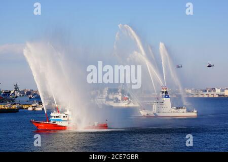 Fire fighting vessels to the water discharge training Stock Photo