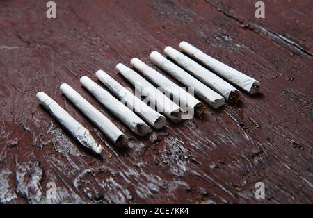 Cigars made of marijuana on the table Stock Photo