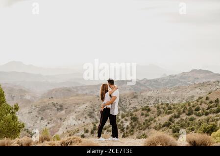Young couple in love enjoying in mountains Stock Photo