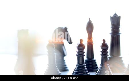 Chess Pieces with sunlight streaming through them Stock Photo
