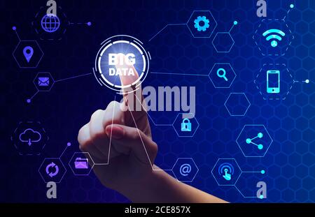 Female hand choosing Big data button on digital screen with different icons Stock Photo