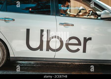 19.12.2019, Istanbul, Turkey. Uber car with driver. Close-up, side view. The concept of a popular and modern urban tansport. Stock Photo