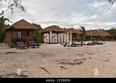 Wooden bungalows on the beach in Koh Rong Sanloem island at sunrise Stock Photo