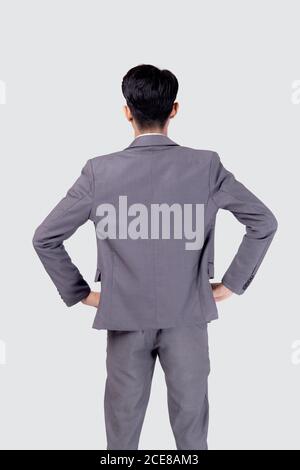 Rear view of young asian businessman in suit with confident isolated on white background, back of portrait business man is manager or executive or emp Stock Photo