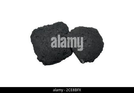 Two black charcoal briquets isolated on white background. Charcoal or coal for bbq fire. Stock Photo