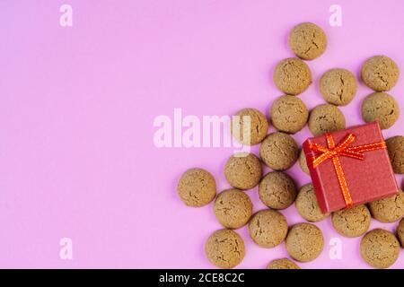 Selective focus!!!Dutch holiday Sinterklaas Greeting Card. St Nicholas Day background with traditional food - pepernoten, chocolate letter, gift, carrots for horse.  Stock Photo