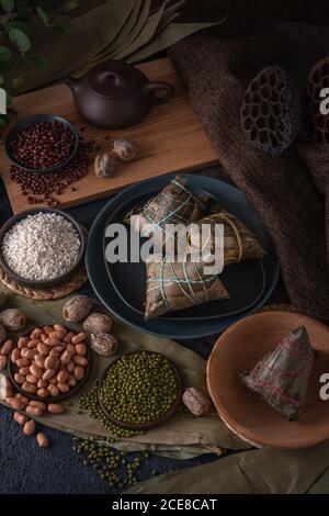 Traditional Chinese rice dumplings called Zongzi. They usually eat them during the traditional Dragon boat festival in June. Stock Photo