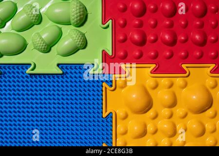 Orthopedic mats view from above. Bright colorful multicolored mats to prevent flat feet and foot massage. Stock Photo