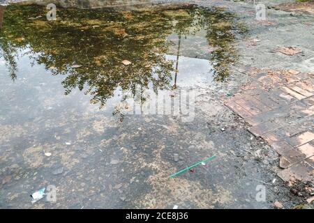 A puddle of old broken paving slabs Stock Photo