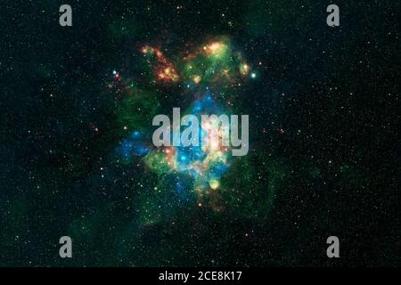 A beautiful green galaxy in deep space. Elements of this image were furnished by NASA. Stock Photo