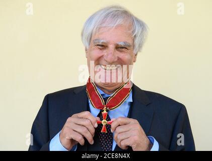 31 August 2020, Brandenburg, Potsdam: Julius Schoeps, founding director of the Moses Mendelssohn Center for European Jewish Studies (MMZ), is delighted with the Grand Cross of Merit of the Order of Merit presented by the Prime Minister of Brandenburg. The historian and political scientist receives the award from the German President for his commitment to tolerance and peaceful coexistence between cultures and religions. Schoeps was, among other things, the initiator of the Jewish Studies program at the University of Potsdam, which was established in 1994/1995. Photo: Soeren Stache/dpa/ZB Stock Photo