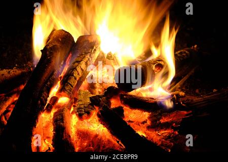 Fire was lit, hot coals in the fire from the burning logs Stock Photo