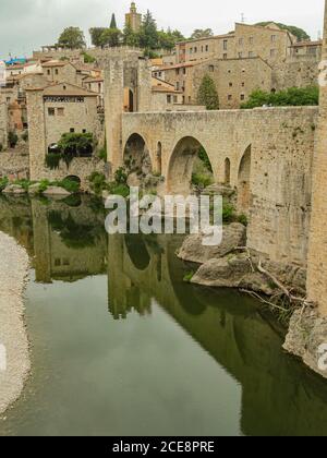 Besalú, Catalonia/Spain; May 15 2013: Besalú medieval fortified bridge, over the Fluvia river Stock Photo