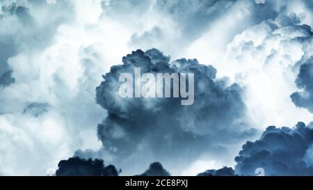 Spectacular abstract background of thunderstorm sky with dark ominous clouds Stock Photo