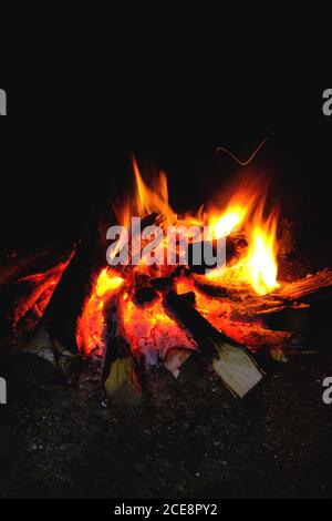 Fire was lit, hot coals in the fire from the burning logs Stock Photo