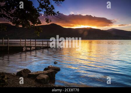 Sunset over Derwent Water from Ashness landing stage in the Lake District. Stock Photo
