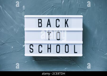 Words BACK TO SCHOOL on gray background Stock Photo
