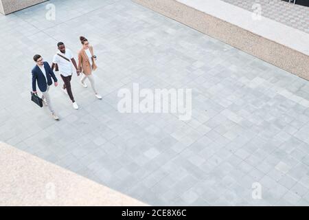 Above view of confident young multi-ethnic specialists going to first job interview or university class Stock Photo