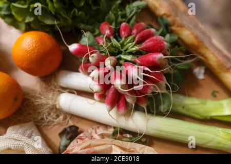 Top view of assorted fresh vegetables and ripe fruits arranged on wooden table Stock Photo