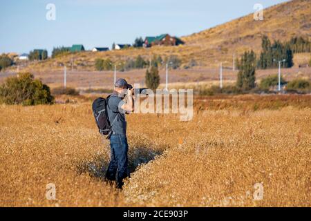 Photographer in action. Stock Photo