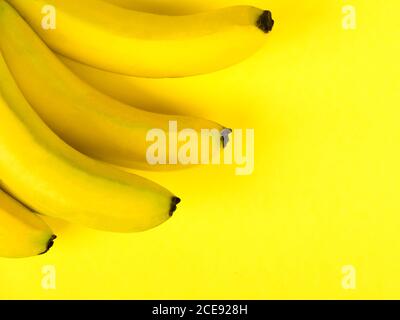 Bunch of bananas on a blue background Stock Photo