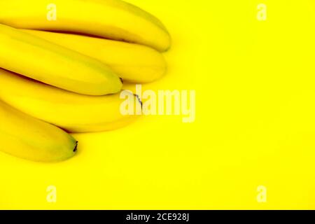 Bunch of bananas on a blue background Stock Photo