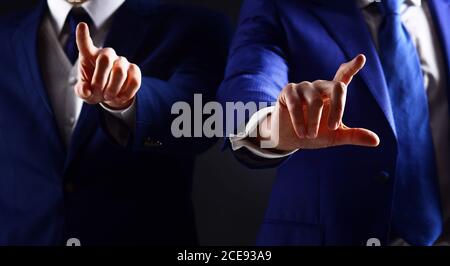 Male hands use modern screen. Business people touching screen. Man pointing finger and pressing on screen. Update technology, success, innovations and communication concept. Partnership and success. Stock Photo