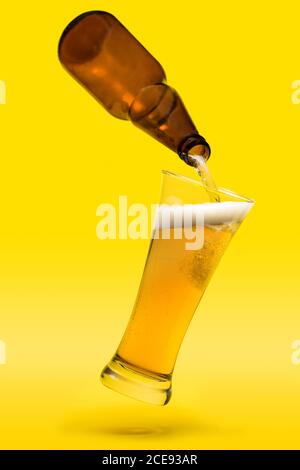 Download Yellow Bottle Cold Beer On Background Of Yellow Glass With Drops Stock Photo Alamy PSD Mockup Templates