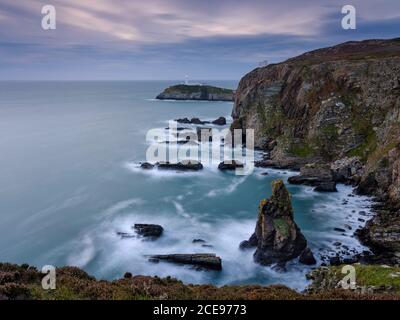Sunset view towards South Stack lighthouse on Anglesey. Stock Photo