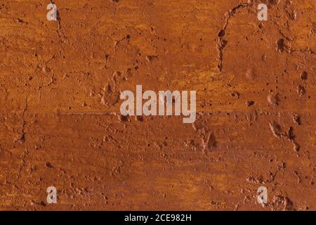 Traditional moroccan terracotta colored background. Orange or ocher clay wall texture. Painted shabby concrete. Stock Photo